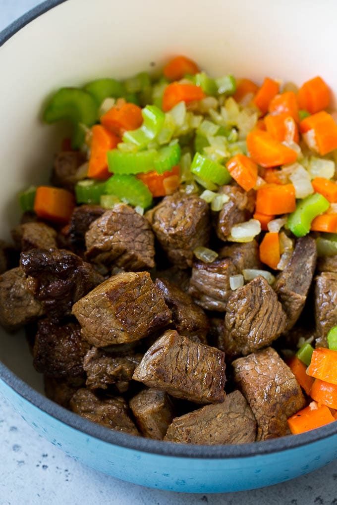 Beef Barley Soup Recipe | Beef Soup | Barley Soup #soup #beef #dinner #vegetables #edsug #comfortfood Stew meat, carrots, onions and celery in a large pot.