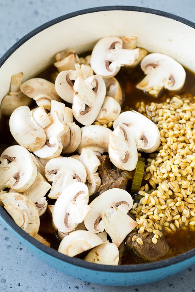 Beef Barley Soup Recipe | Beef Soup | Barley Soup #soup #beef #dinner #vegetables #edsug #comfortfood Beef barley soup with sliced mushrooms and barley stirred in.