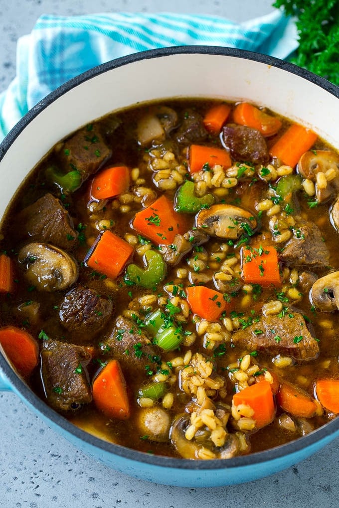 Beef Barley Soup Recipe | Beef Soup | Barley Soup #soup #beef #dinner #vegetables #edsug #comfortfood A pot full of beef barley soup made with beef stew meat, barley and vegetables all simmered together.