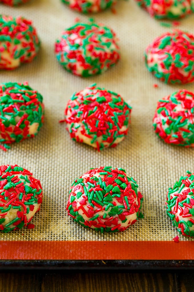 Cake Mix Cookies Recipe | Sprinkle Cookies | Christmas Cookies #cookies #christmas #sprinkles #dessert #baking #edsug Balls of dough rolled in sprinkles.