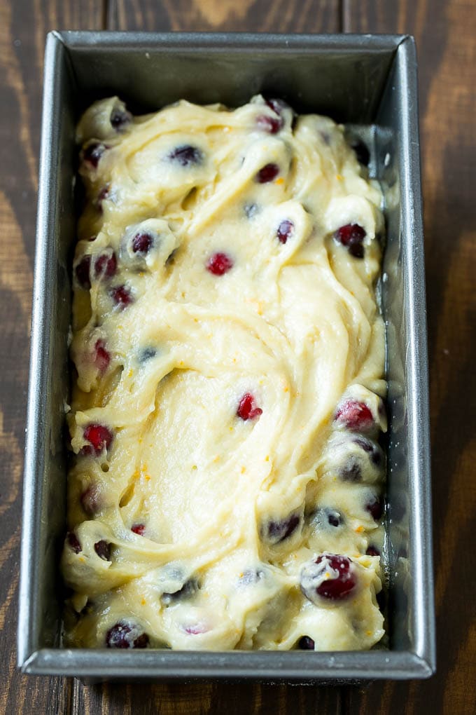 Cranberry Bread Recipe | Cranberry Loaf | Cranberry Orange Bread #cranberry #bread #baking #dessert #fall #edsug Ccranberry bread batter spread into a loaf pan.