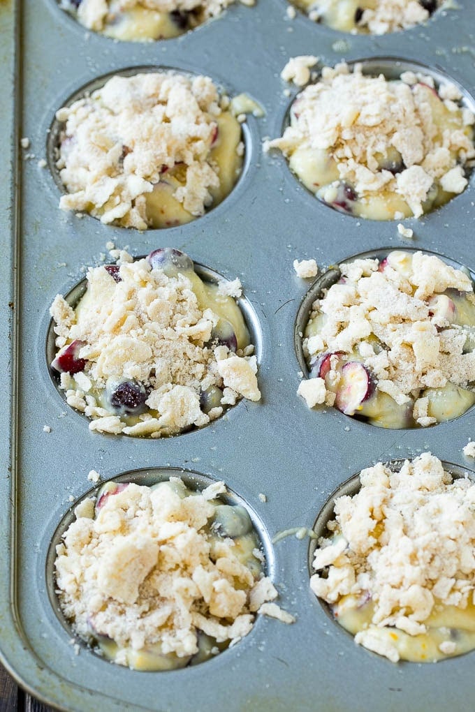 Cranberry Muffins Recipe | Cranberry Orange Muffins #cranberry #muffins #orange #fall #dessert #edsug Muffins topped with streusel ready to go into the oven.