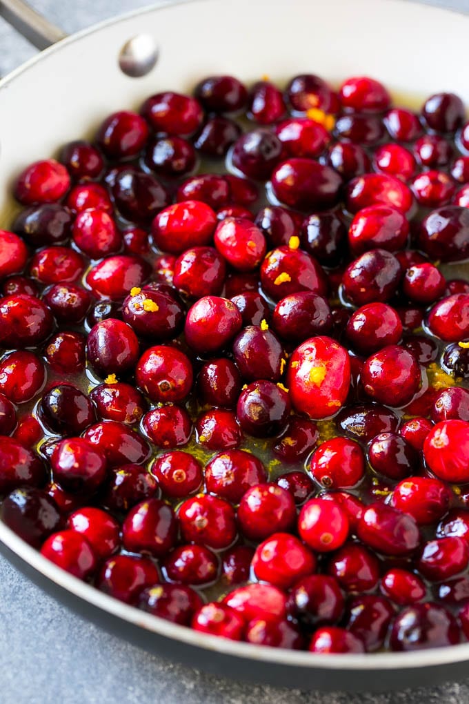 Cranberry Orange Sauce Recipe | Homemade Cranberry Sauce | Fresh Cranberry Sauce #cranberry #orange #fall #thanksgiving #sauce #dinner #edsug Berries in a skillet with orange juice, sugar and orange zest.