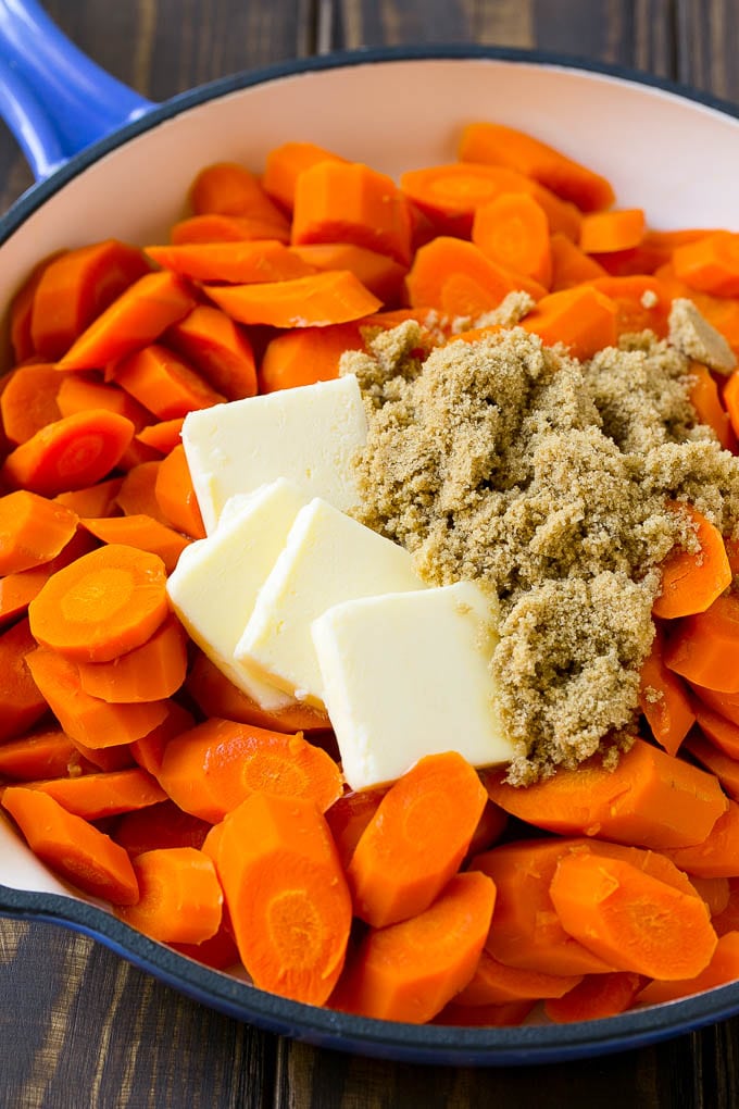 Glazed Carrots Recipe | Brown Sugar Carrots | Carrot Side Dish #carrots #brownsugar #sidedish #glutenfree #thanksgiving #fall #dinner #edsug Sliced cooked carrots with butter and brown sugar.