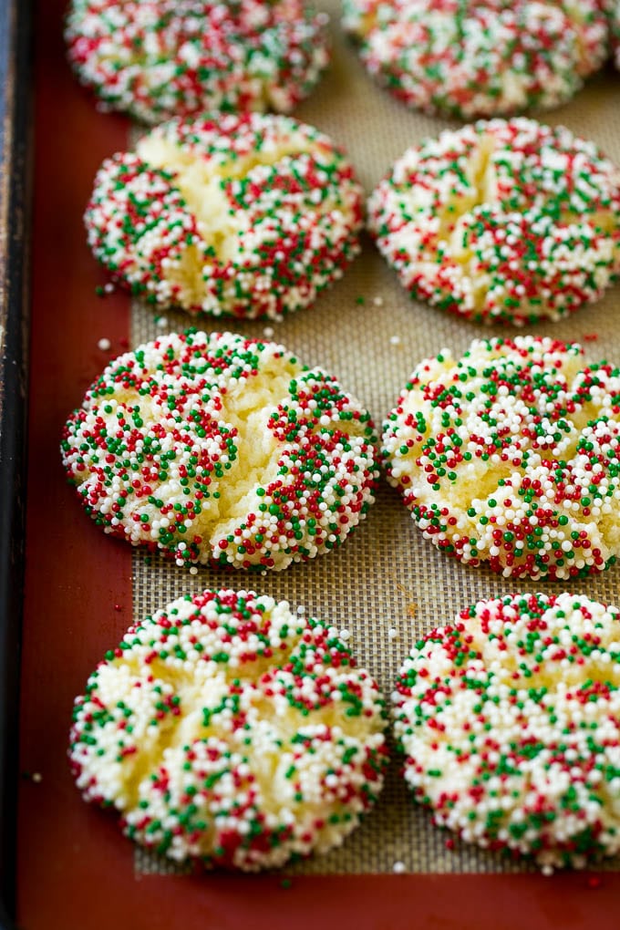 Gooey Butter Cookies Recipe | Cake Mix Cookies | Sprinkle Cookies | Christmas Cookies #cookies #butter #sprinkles #christmas #dessert #baking #edsug Baked gooey butter cookies on a sheet pan.