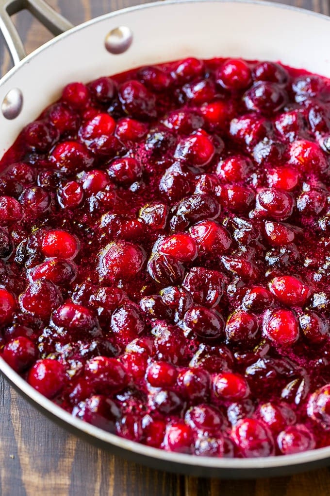 This homemade cranberry sauce is a 6 ingredient recipe that's made with fresh cranberries, sugar and a hint of spice. Homemade cranberry sauce in a skillet.