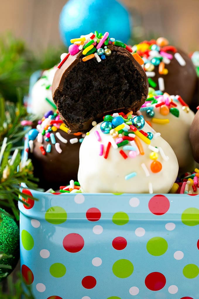 A cross section of an Oreo ball inside a holiday gift tin.