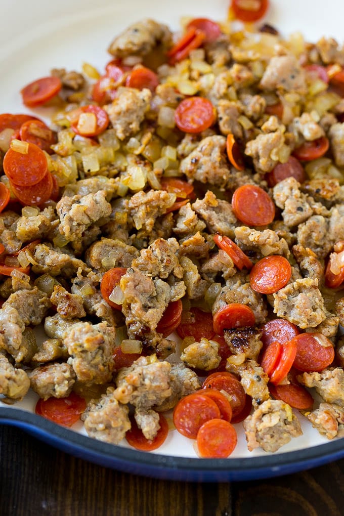 Pizza Pasta Recipe | Pepperoni Pasta | Sausage Pasta #italian #pepperoni #sausage #pizza #pasta #dinner #edsug #onepot A pan of cooked sausage, pepperoni and onions.
