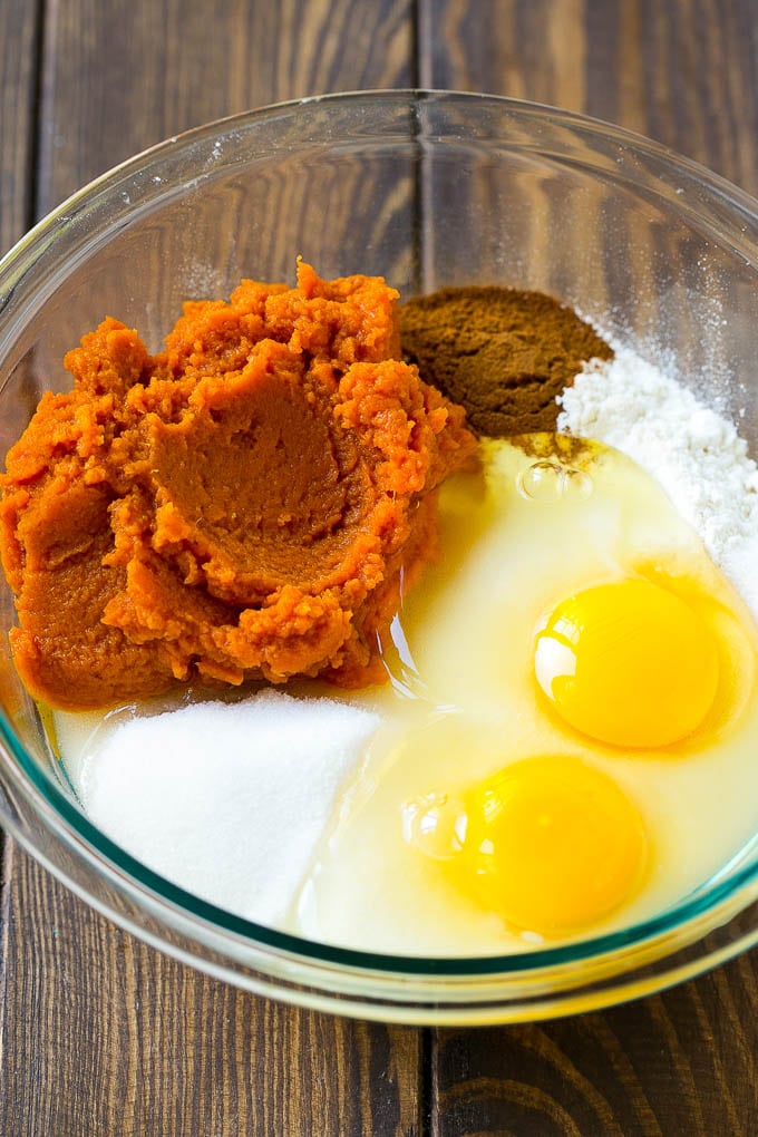 Pumpkin Chocolate Chip Bread Recipe | Pumpkin Bread | Chocolate Pumpkin Bread #pumpkin #bread #fall #chocolate #baking #dessert #edsug Sugar, eggs, pumpkin puree, flour and spices in a mixing bowl.