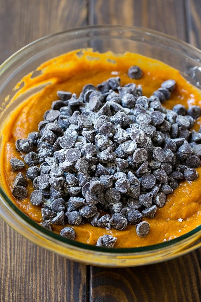 Pumpkin Chocolate Chip Bread Recipe | Pumpkin Bread | Chocolate Pumpkin Bread #pumpkin #bread #fall #chocolate #baking #dessert #edsug Pumpkin bread batter with chocolate chips in it.