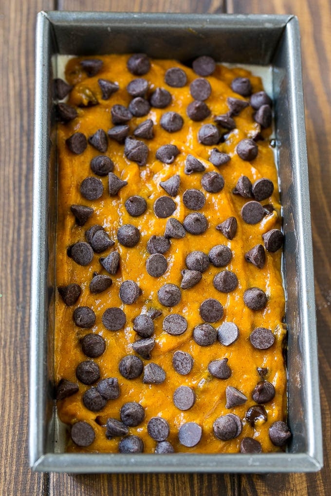 Pumpkin Chocolate Chip Bread Recipe | Pumpkin Bread | Chocolate Pumpkin Bread #pumpkin #bread #fall #chocolate #baking #dessert #edsug A loaf pan of pumpkin chocolate chip bread batter.