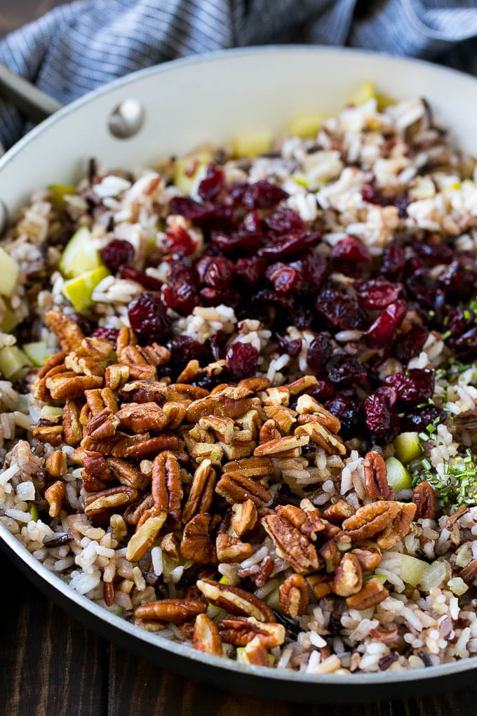 Wild Rice Pilaf Recipe | Thanksgiving Side Dish | Rice Pilaf #rice #apple #cranberry #fall #glutenfree #thanksgiving #edsug Apples and wild rice topped with dried cranberries, pecans and herbs.