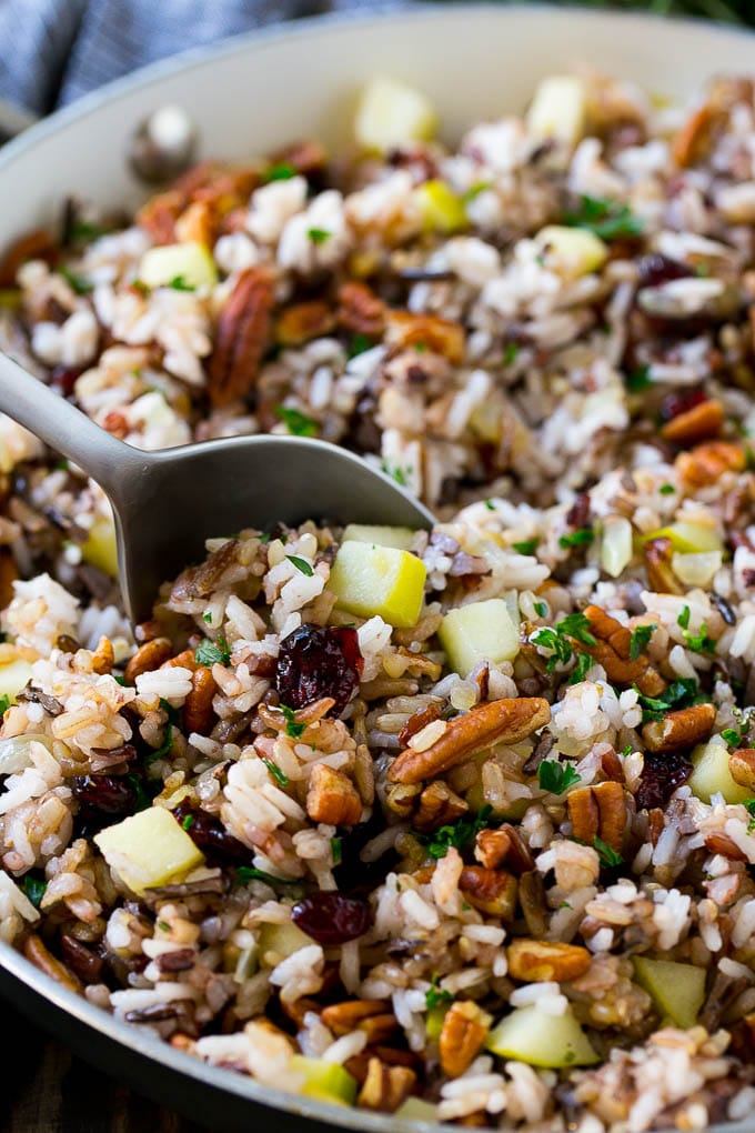 Wild Rice Pilaf Recipe | Thanksgiving Side Dish | Rice Pilaf #rice #apple #cranberry #fall #glutenfree #thanksgiving #edsug A skillet of rice pilaf with apples, cranberries and pecans.