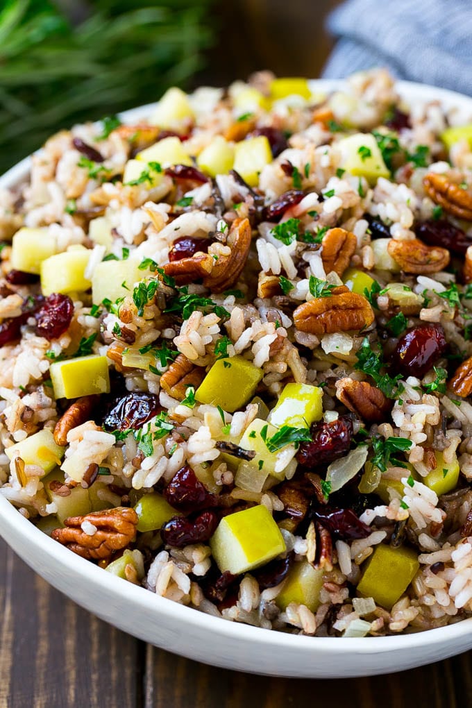 Wild Rice Pilaf Recipe | Thanksgiving Side Dish | Rice Pilaf #rice #apple #cranberry #fall #glutenfree #thanksgiving #edsug A serving bowl of rice pilaf made with wild rice, apples, cranberries and pecans.