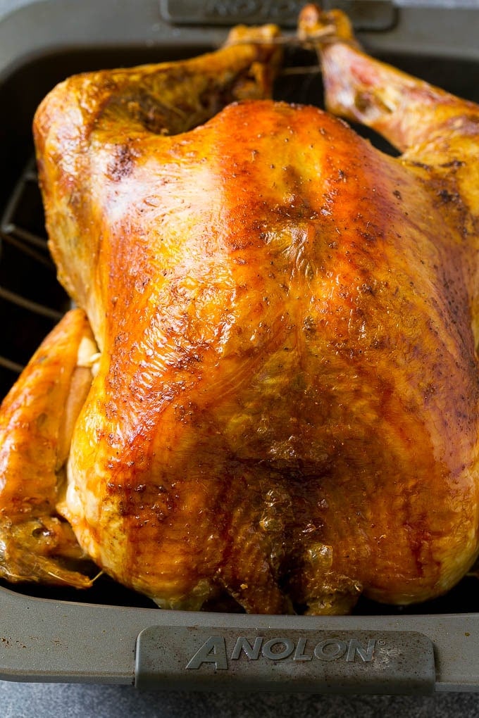 Roast Turkey Recipe | Thanksgiving Turkey | Holiday Turkey | Baked Turkey #turkey #thanksgiving #christmas #dinner #glutenfree #edsug A roasted turkey in a baking pan.