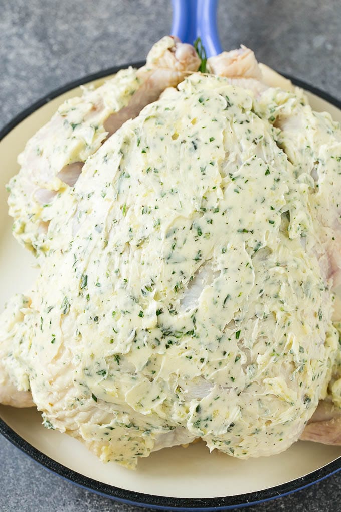 Roasted Chicken Recipe | Whole Roasted Chicken | Roast Chicken #chicken #dinner #lowcarb #keto #edsug A raw whole chicken coated in garlic and herb butter.