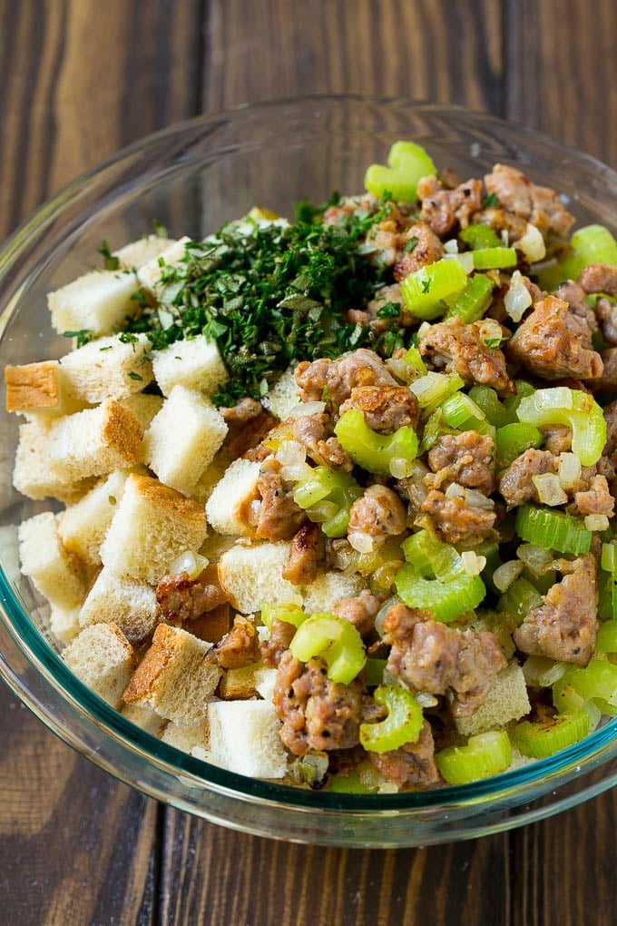 Sausage Stuffing Recipe | Thanksgiving Stuffing | Make Ahead Stuffing #stuffing #thanksgiving #sausage #sidedish #dinner #edsug Meat, sauteed vegetables and bread cubes in a mixing bowl.