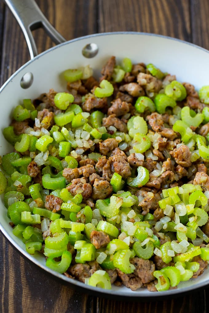 Sausage Stuffing Recipe | Thanksgiving Stuffing | Make Ahead Stuffing #stuffing #thanksgiving #sausage #sidedish #dinner #edsug A pan of cooked sausage, celery and onions.
