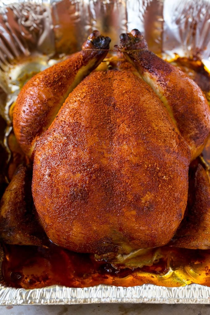 Smoked Chicken Recipe | Whole Smoked Chicken | BBQ Chicken #chicken #smoker #BBQ #dinner #edsug #glutenfree #lowcarb A whole smoked chicken in a roasting pan.