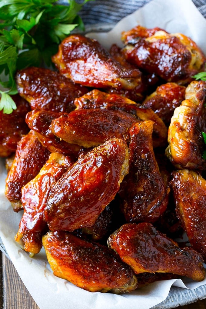 Smoked Chicken Wings | Barbecue Chicken Wings | BBQ Chicken Wings #chicken #wings #bbq #barbecue #appetizer #dinner #edsug Smoked chicken wings brushed with homemade BBQ sauce on a serving plate.