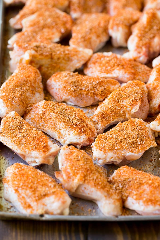 Smoked Chicken Wings | Barbecue Chicken Wings | BBQ Chicken Wings #chicken #wings #bbq #barbecue #appetizer #dinner #edsug Raw chicken wings coated in homemade spice rub on a sheet pan.
