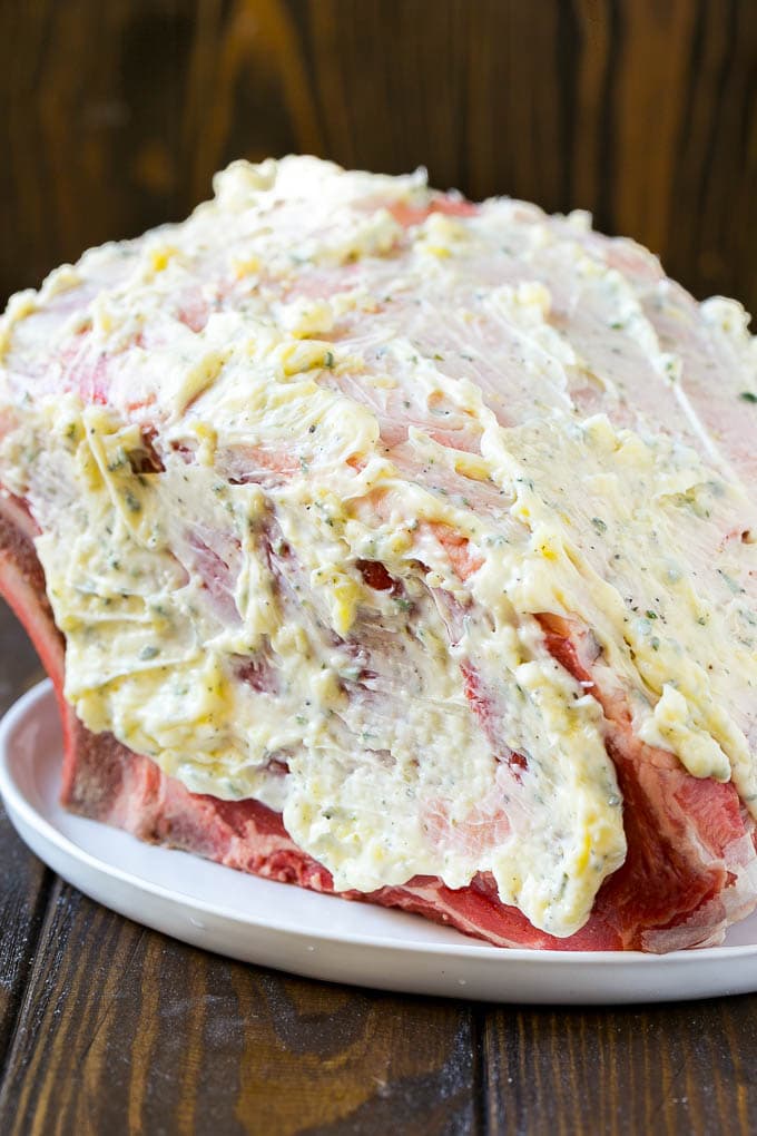 Smoked Prime Rib Recipe | Easy Prime Rib | Smoked Beef | Holiday Prime Rib #primerib #beef #smoker #dinner #edsug #christmas #thanksgiving #lowcarb #keto A roast coated in garlic and herb butter.