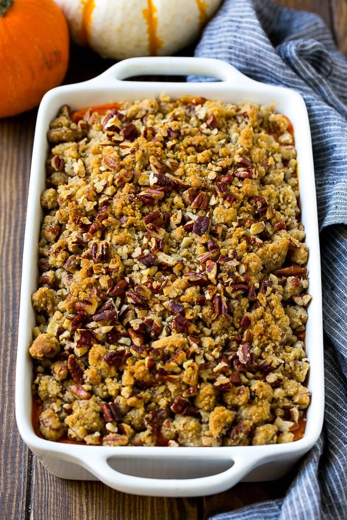 Sweet Potato Casserole with Pecans Recipe | Sweet Potato Casserole | Sweet Potato Side Dish #sweetpotatoes #thanksgiving #pecans #casserole #sidedish #holiday #fall #edsug Sweet potato casserole with pecans and brown sugar streusel in a baking dish.