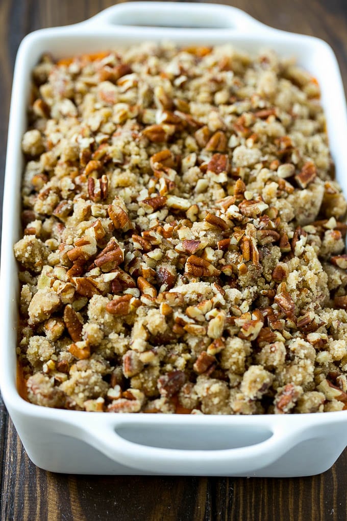 Sweet Potato Casserole with Pecans Recipe | Sweet Potato Casserole | Sweet Potato Side Dish #sweetpotatoes #thanksgiving #pecans #casserole #sidedish #holiday #fall #edsug An uncooked sweet potato casserole with pecan streusel.