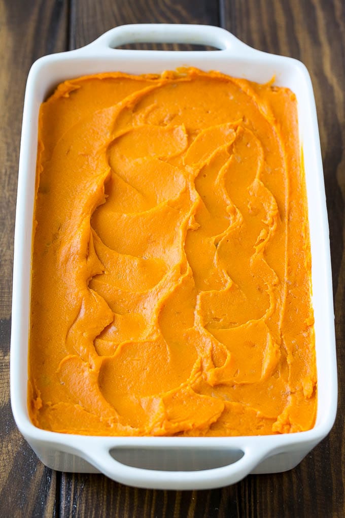 Sweet Potato Casserole with Pecans Recipe | Sweet Potato Casserole | Sweet Potato Side Dish #sweetpotatoes #thanksgiving #pecans #casserole #sidedish #holiday #fall #edsug Mashed sweet potatoes in a baking dish.