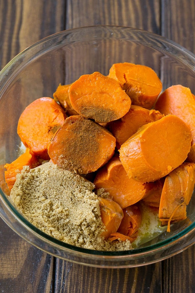 Sweet Potato Casserole with Pecans Recipe | Sweet Potato Casserole | Sweet Potato Side Dish #sweetpotatoes #thanksgiving #pecans #casserole #sidedish #holiday #fall #edsug Sliced sweet potatoes with brown sugar, butter and spices.