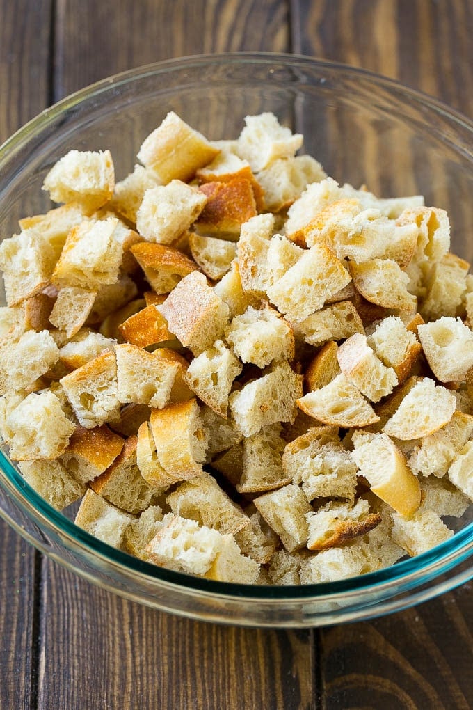 Turkey Stuffing Recipe | Thanksgiving Stuffing | Classic Stuffing #thanksgiving #stuffing #sidedish #fall #edsug Dried bread cubes in a mixing bowl.