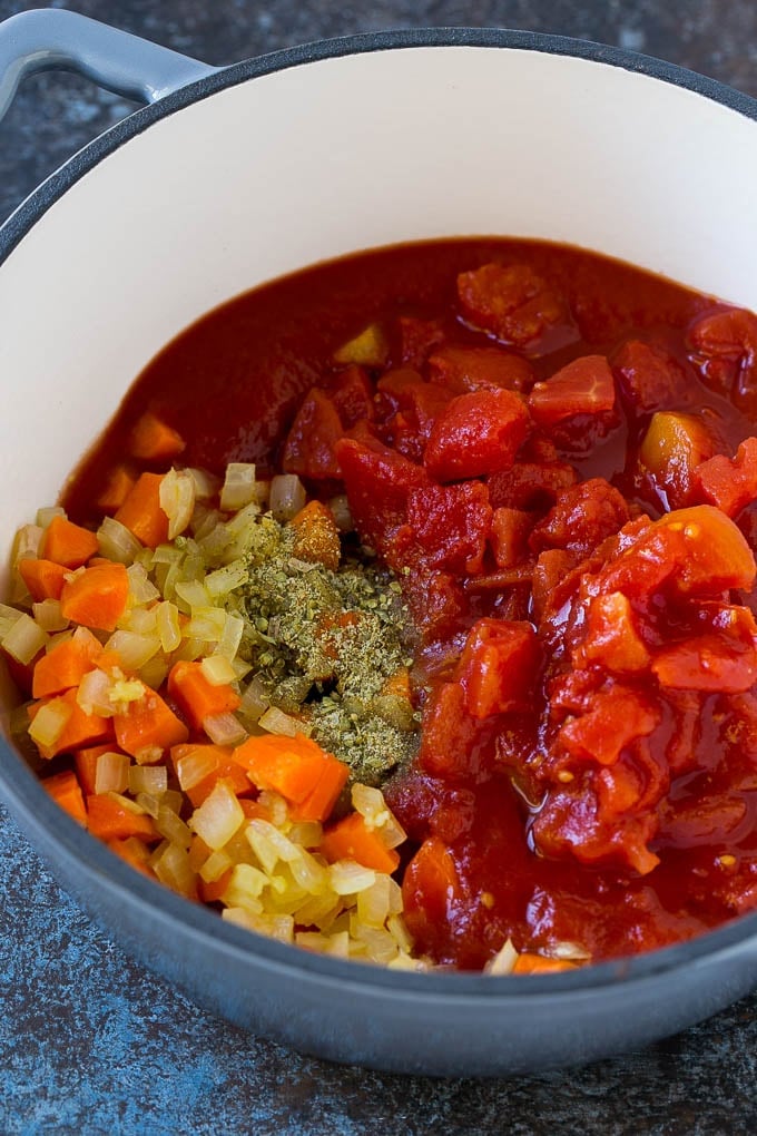 Albondigas Soup | Meatball Soup | Mexican Soup #soup #meatballs #beef #rice #glutenfree #dinner #edsug #comfortfood Vegetables, tomatoes and herbs in a soup pot.