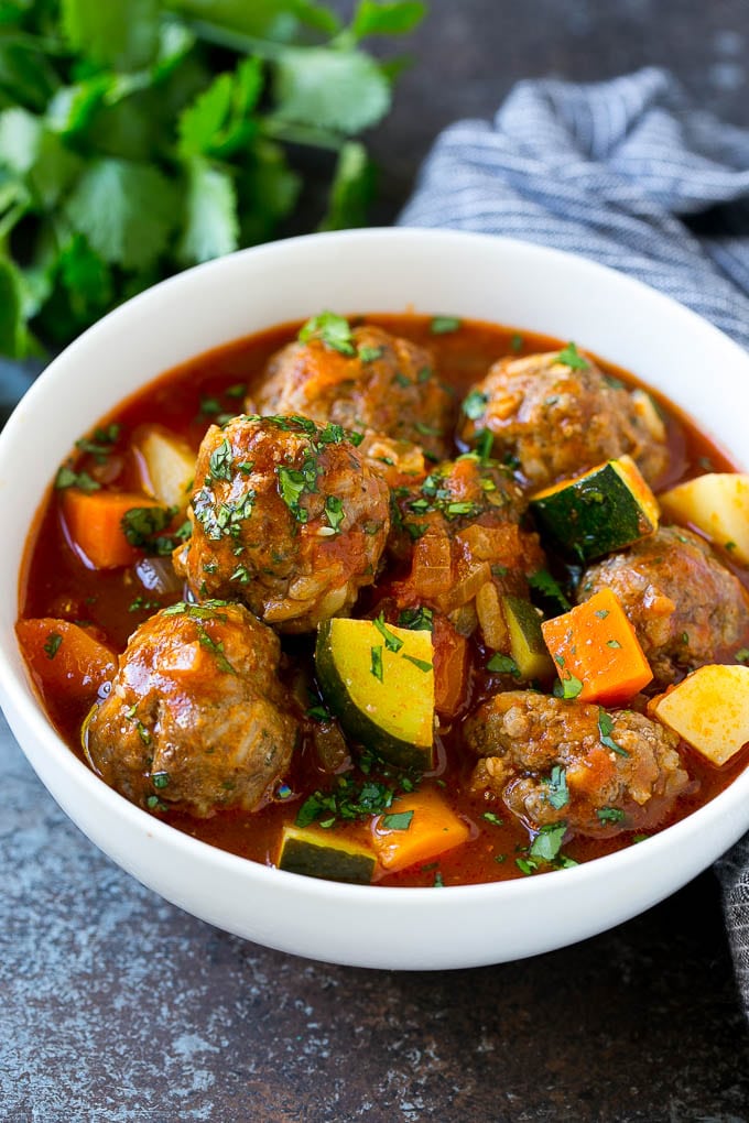 Albondigas Soup | Meatball Soup | Mexican Soup #soup #meatballs #beef #rice #glutenfree #dinner #edsug #comfortfood A bowl of albondigas soup with meatballs, carrots, zucchini and tomatoes.