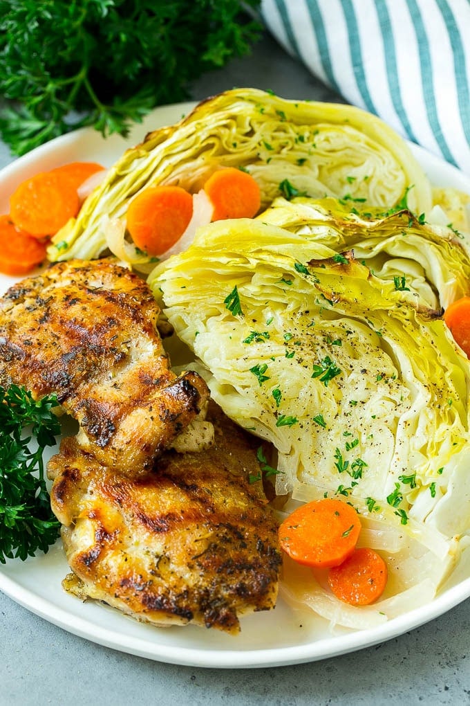 Braised Cabbage Recipe | Easy Cabbage Recipe #cabbage #lowcarb #keto #carrots #veggies #vegetarian #dinner #edsug A plate of grilled chicken along with braised cabbage, carrots and onions.