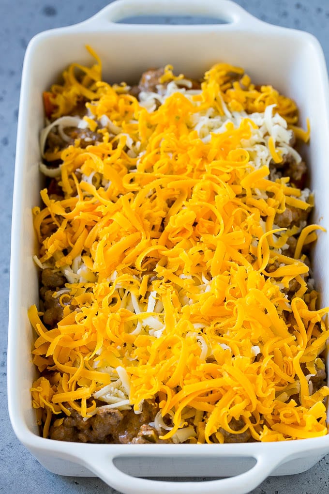 Dorito Casserole Recipe | Mexican Casserole | Beef Casserole #mexicanfood #beef #groundbeef #casserole #dinner #edsug A dish layered with chips, ground beef and shredded cheese.