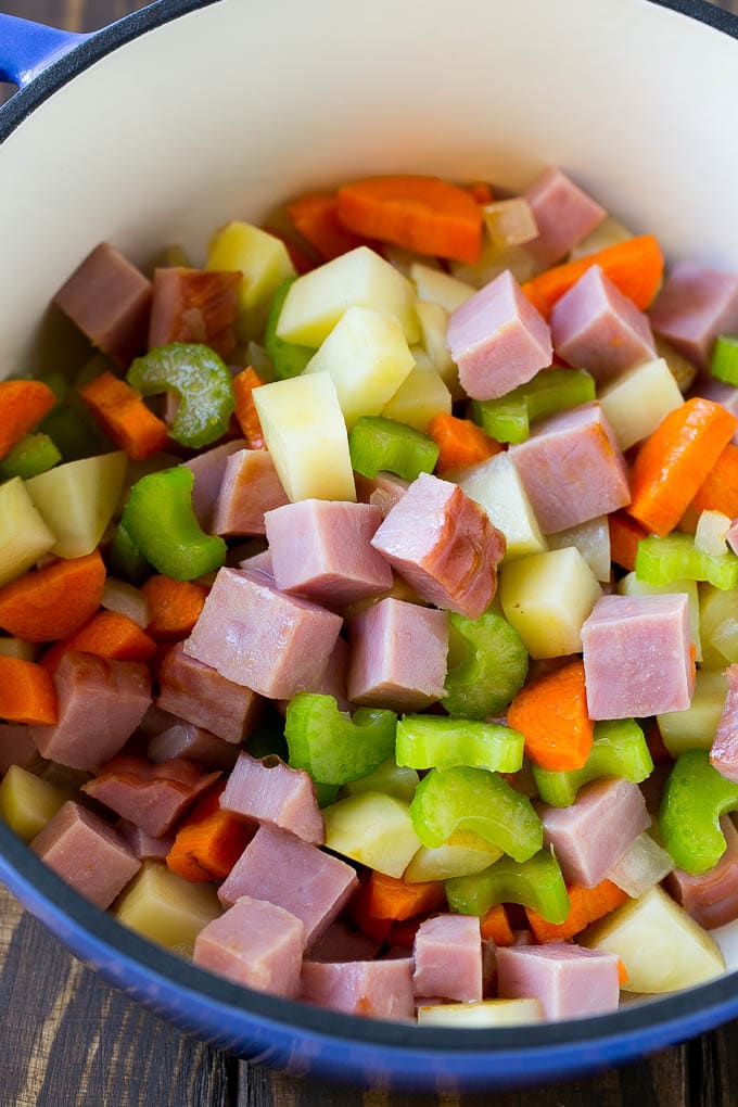 Ham and Potato Soup | Ham Soup | Potato Soup #soup #ham #potato #dinner #comfortfood #edsug Diced ham, carrots, potatoes and celery in a soup pot.