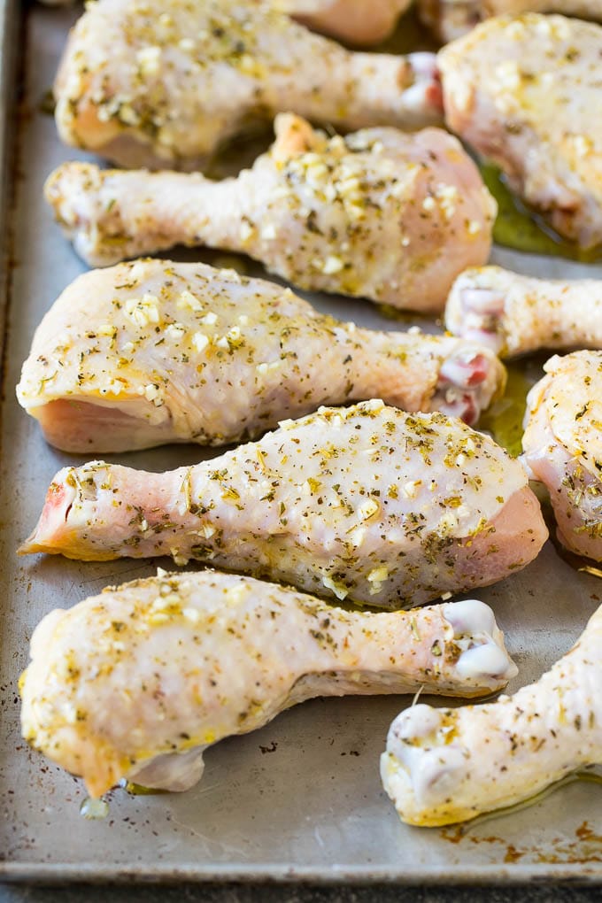 Baked Chicken Drumsticks Recipe | Roasted Chicken Drumsticks | Garlic and Herb Chicken #dinner #chicken #garlic #glutenfree #lowcarb #keto #cleaneating #edsug Marinated chicken legs on a sheet pan, ready to go into the oven.