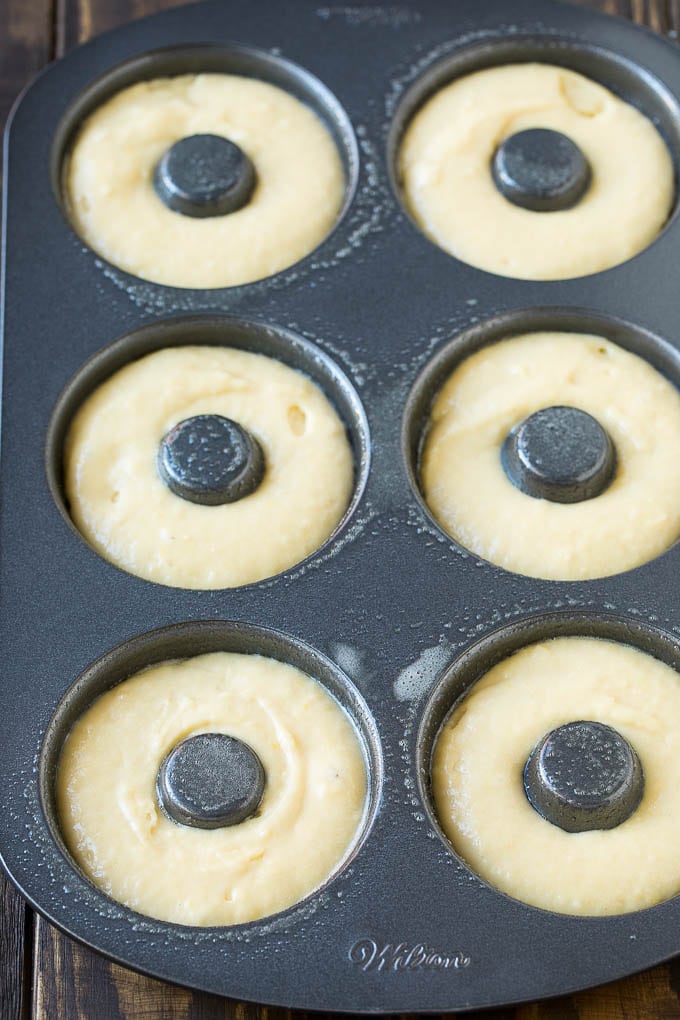 Baked Donuts Recipe | Cake Donuts | Chocolate Donuts | Sprinkle Donuts #donuts #chocolate #sprinkles #breakfast #brunch #edsug A donut pan filled with dough.