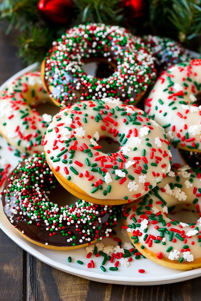 Baked Donuts Recipe | Cake Donuts | Chocolate Donuts | Sprinkle Donuts #donuts #chocolate #sprinkles #breakfast #brunch #edsug A serving plate of baked donuts frosted in dark and white chocolate and topped with sprinkles.