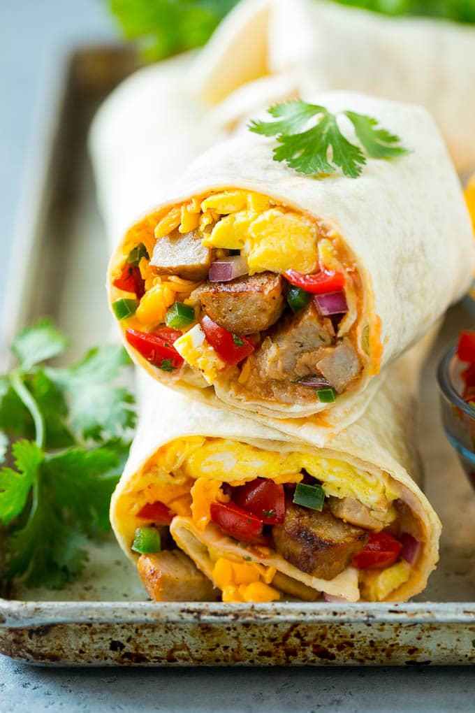 Breakfast Burrito Recipe | Sausage Breakfast Burrito #breakfast #sausage #eggs #burrito #edsug A cross section of a breakfast burrito filled with eggs, sausage, beans and cheese.