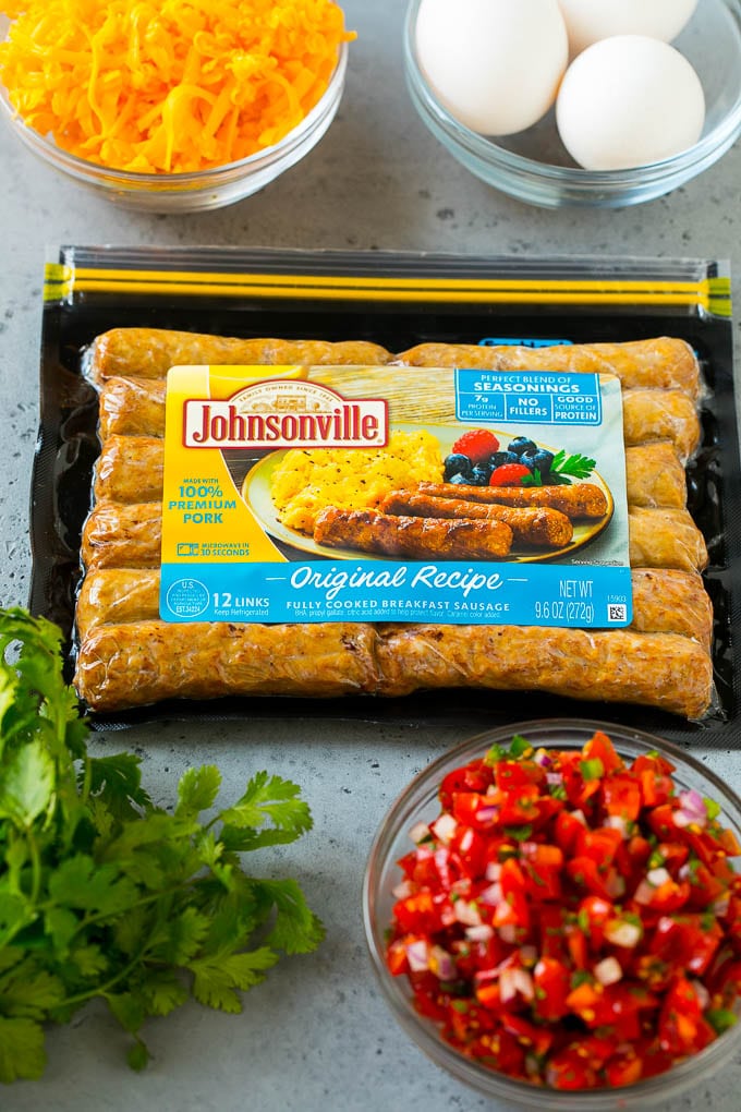 Breakfast Burrito Recipe | Sausage Breakfast Burrito #breakfast #sausage #eggs #burrito #edsug A package of sausage links along with bowls of pico de gallo, eggs and shredded cheese.