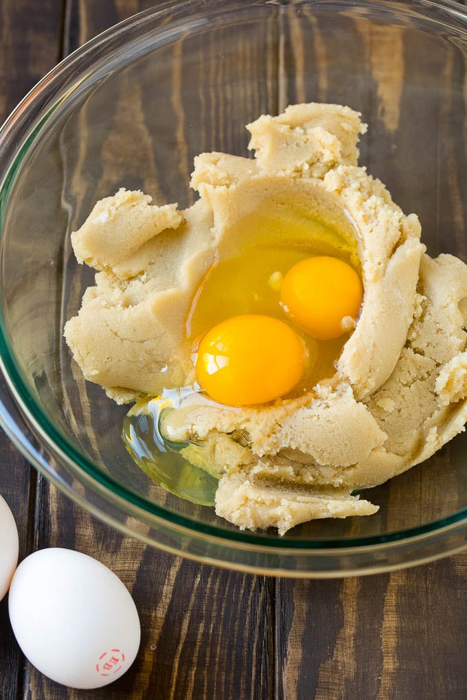 Eggnog Cookies Recipe | Holiday Cookies | Christmas Cookies #cookies #eggnog #baking #christmas #sprinkles #dessert #edsug Butter, sugar and eggs in a mixing bowl.