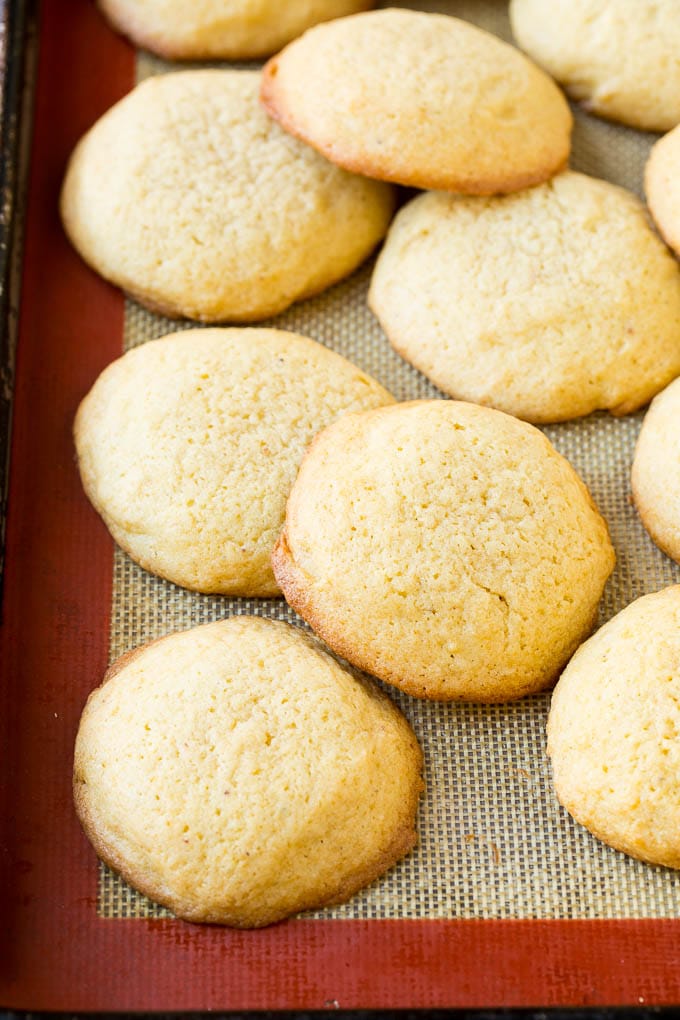 Eggnog Cookies Recipe | Holiday Cookies | Christmas Cookies #cookies #eggnog #baking #christmas #sprinkles #dessert #edsug Baked eggnog cookies on a sheet pan.