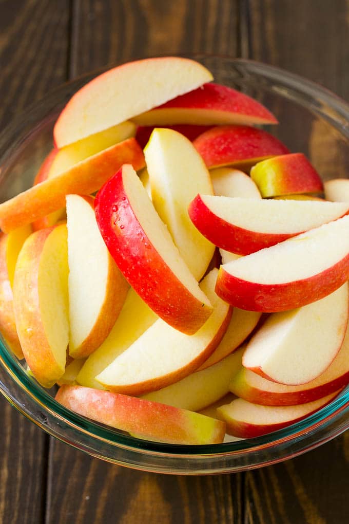 Fried Apples Recipe | Sauteed Apples | Cinnamon Sugar Apples #apples #cinnamon #sugar #sidedish #dessert #edsug #fall Sliced apples in a mixing bowl.