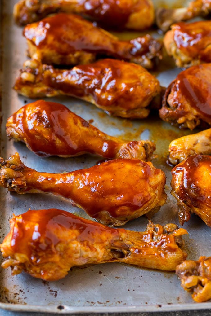 Slow Cooker Chicken Drumsticks Recipe | Crock Pot Chicken Drumsticks | BBQ Chicken Drumsticks #chicken #drumsticks #slowcooker #crockpot #bbq #dinner #edsug Slow cooker chicken drumsticks on a sheet pan, ready for the broiler.