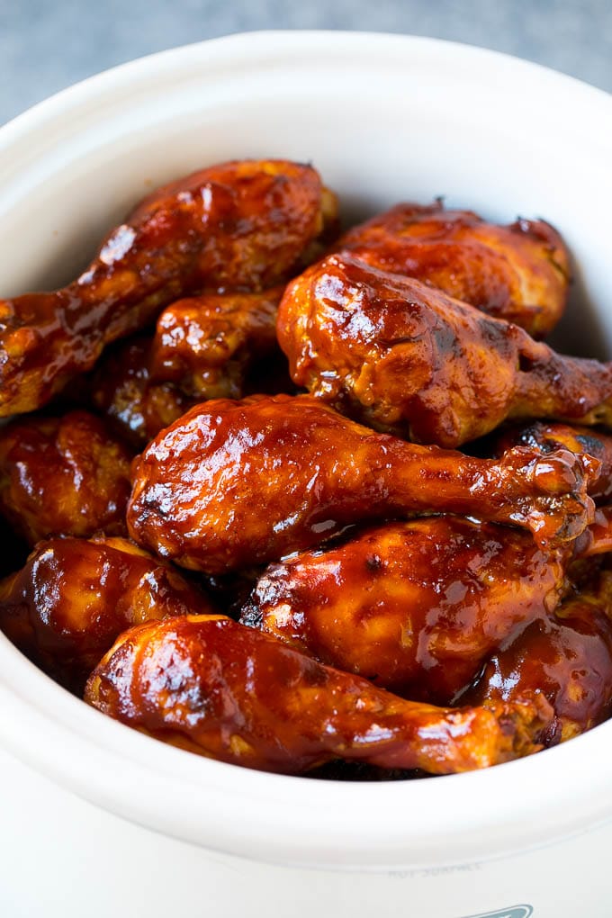 Slow Cooker Chicken Drumsticks Recipe | Crock Pot Chicken Drumsticks | BBQ Chicken Drumsticks #chicken #drumsticks #slowcooker #crockpot #bbq #dinner #edsug Slow cooker chicken drumsticks coated in BBQ sauce inside a crock pot.