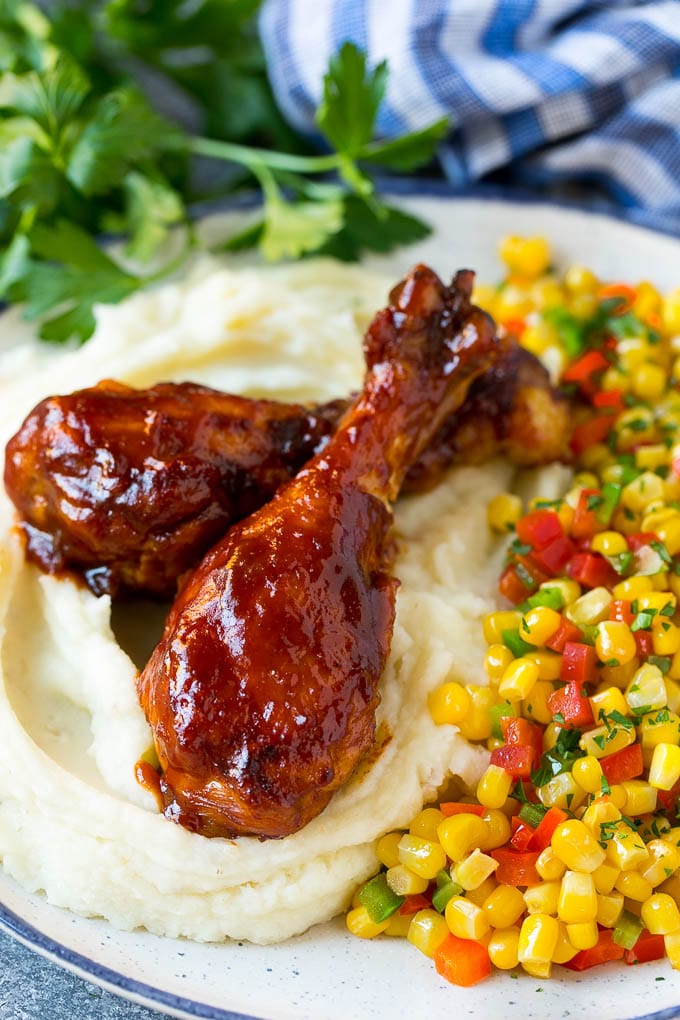 Slow Cooker Chicken Drumsticks Recipe | Crock Pot Chicken Drumsticks | BBQ Chicken Drumsticks #chicken #drumsticks #slowcooker #crockpot #bbq #dinner #edsug Slow cooker chicken drumsticks served with mashed potatoes and corn.