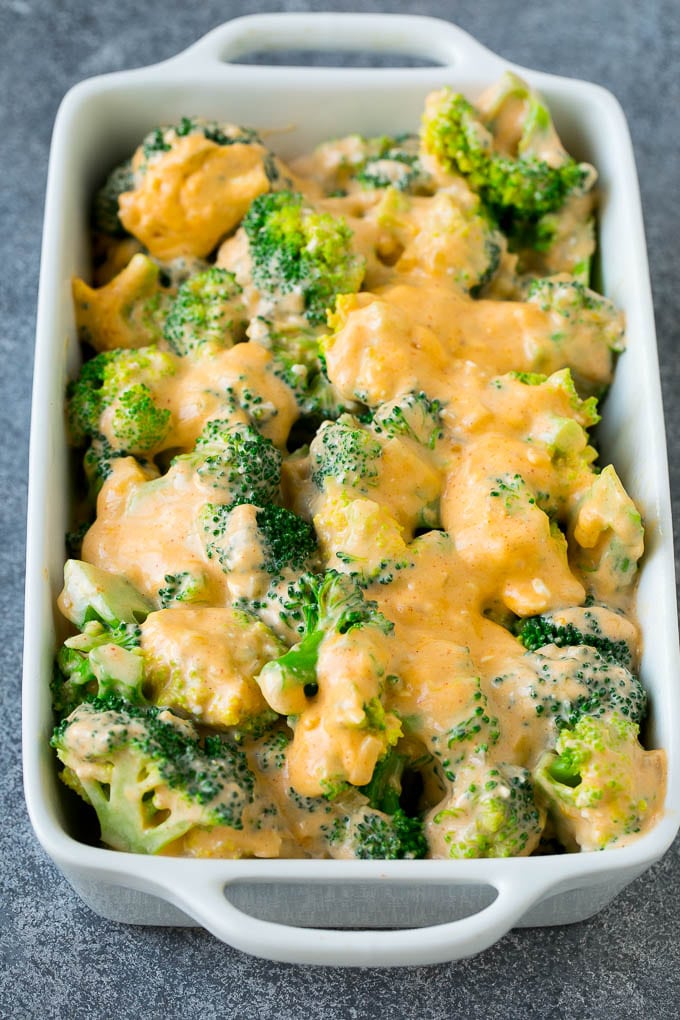 Broccoli Casserole Recipe | Broccoli and Cheese Casserole | Baked Broccoli #broccoli #cheese #casserole #sidedish #dinner #edsug Florets in a baking dish coated with cheese sauce.