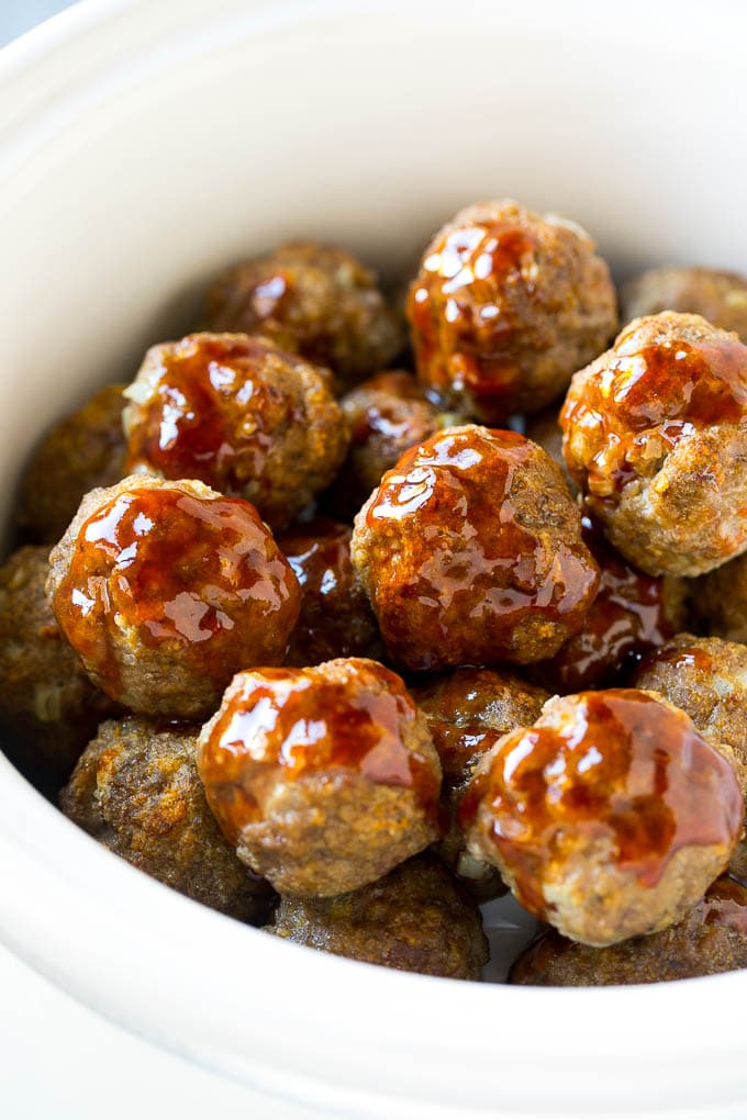 Sweet and Sour Meatballs Recipe | Slow Cooker Meatballs | Crockpot Meatballs | Cocktail Meatballs #meatballs #beef #slowcooker #crockpot #dinner #appetizer #edsug Meatballs in a slow cooker coated in sweet and sour sauce.