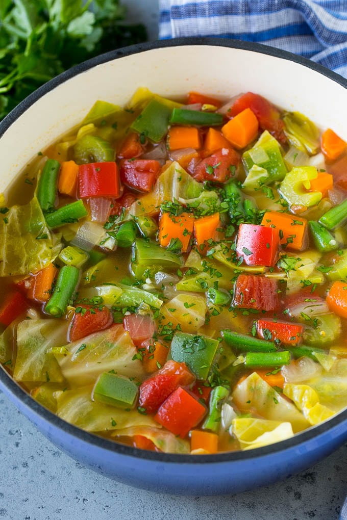 Cabbage Soup Recipe | Vegetable Soup | Veggie Soup | Healthy Soup #soup #healthy #cleaneating #cabbage #vegetables #veggies #dinner #edsug A pot of cabbage soup with carrots, celery, bell peppers and green beans.